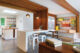 open kitchen renovation with mahogany beams as support