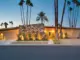 desert MCM home with stone accents and recessed entry